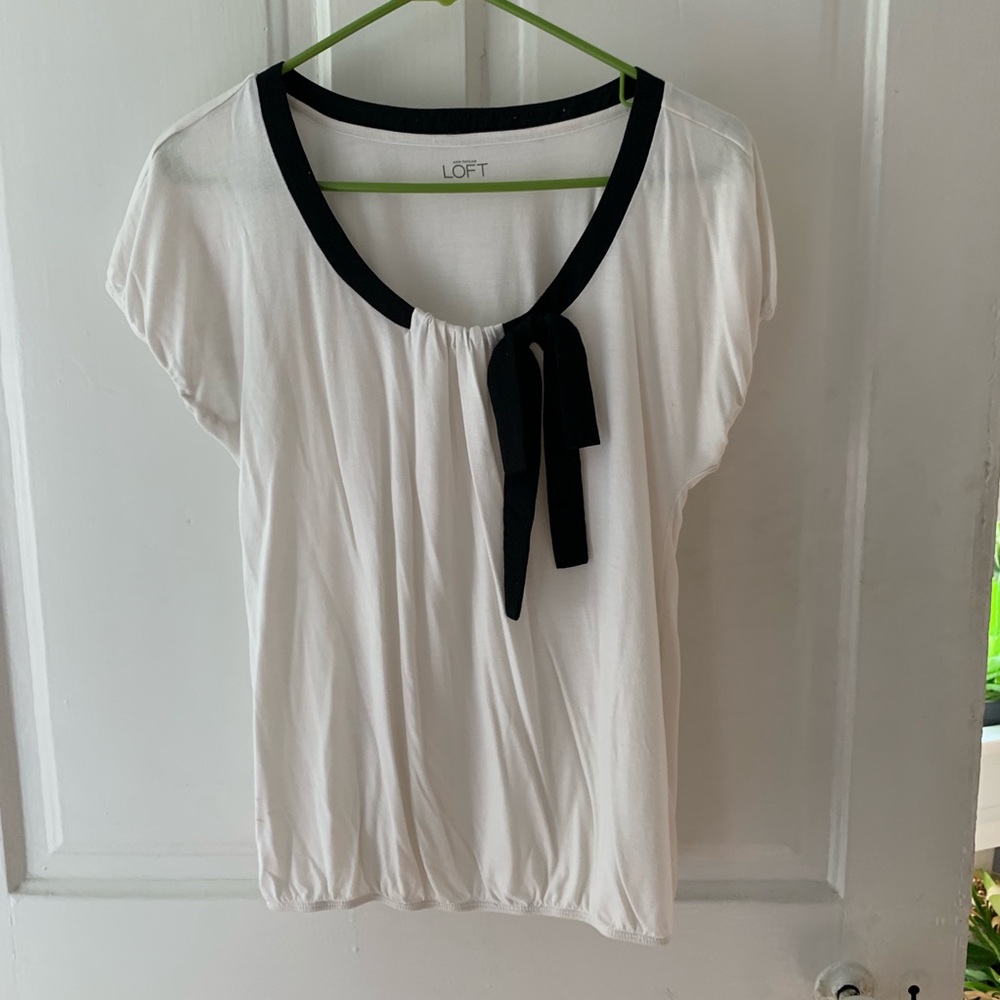 Small loft white top with black bow/tie